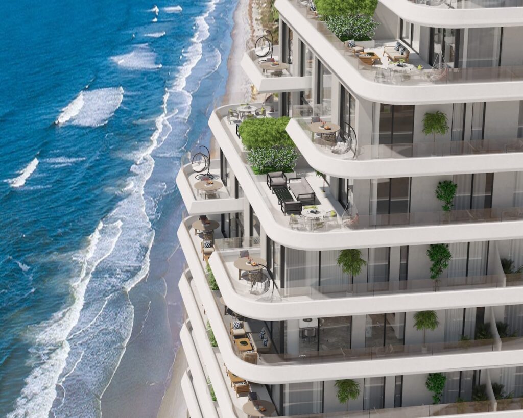Bir sanatçının sahildeki bir apartman binasını tasvir etmesi.