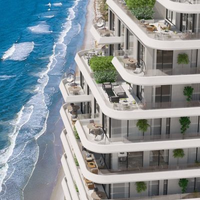 Bir sanatçının sahildeki bir apartman binasını tasvir etmesi.